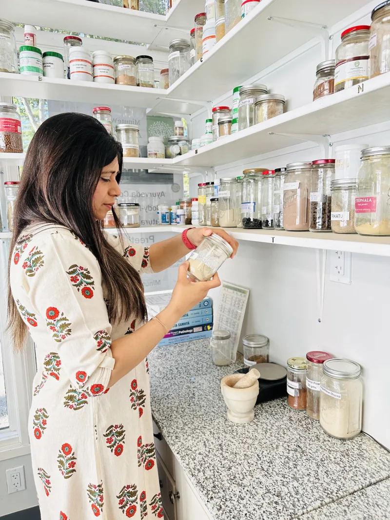 Preeti Gupta with herbs and oils at the Minute Wonder Ayurveda clinic in San Ramon